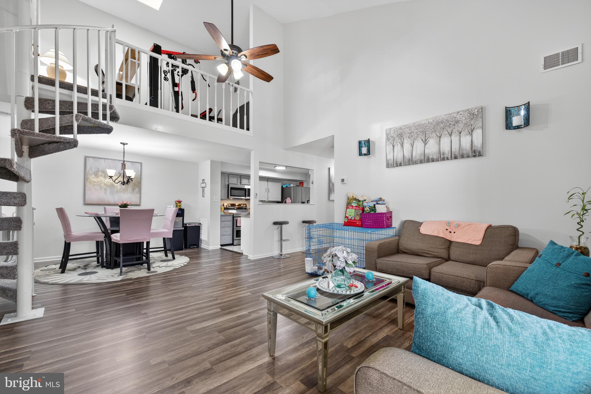 20617 Shadyside Way, Unit 997 Germantown, MD 20874 - Photo 3 of 23 a living room with furniture a ceiling fan and a wooden floor