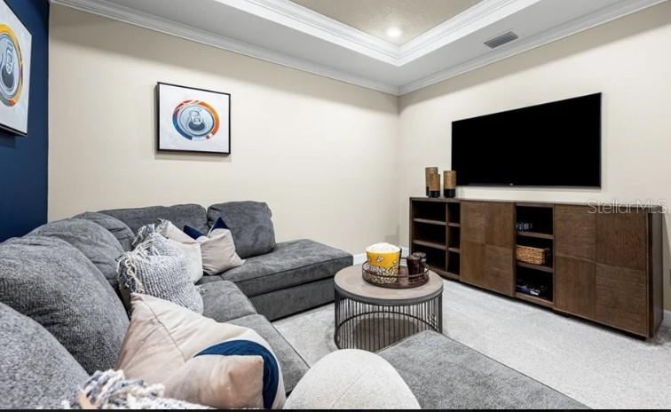 11270 Kingly Lane Odessa, FL 33556 - Photo 12 of 19 a living room with furniture and a flat screen tv