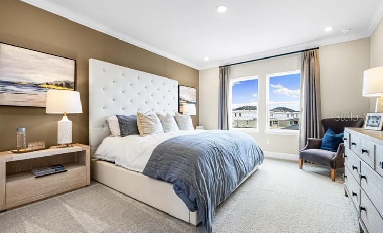 11270 Kingly Lane Odessa, FL 33556 - Photo 15 of 19 a bedroom with a bed and large window