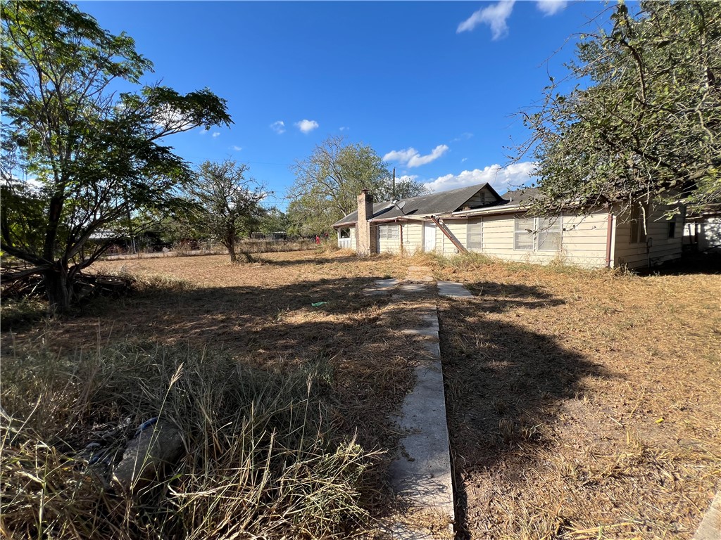 113 4th Street Mathis, TX 78368 - Photo 11 of 13 a view of yard with tree in it