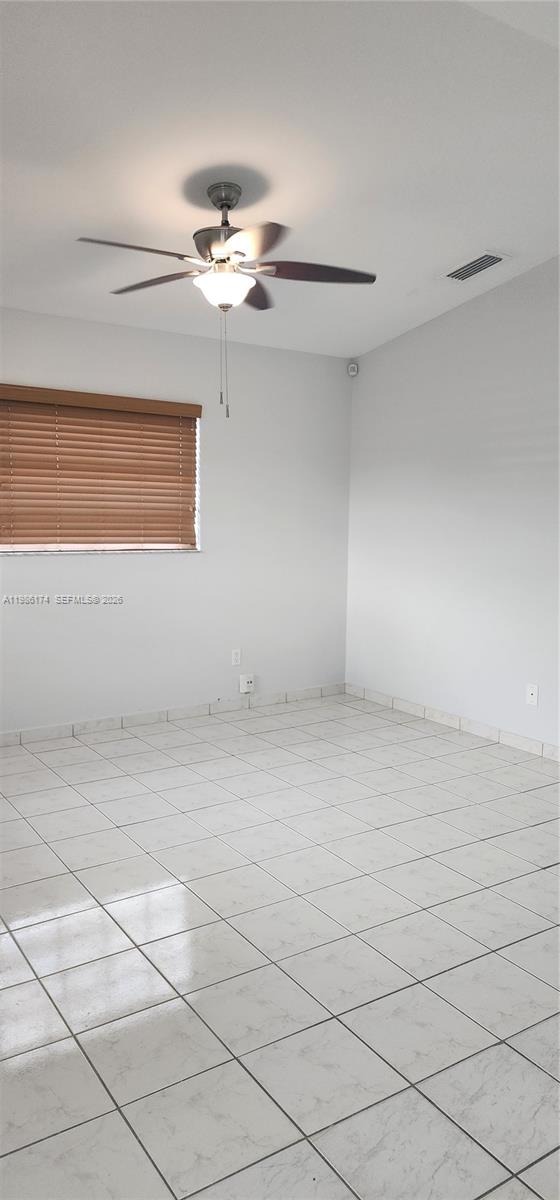 2574 West 71st Place Hialeah, FL 33016 - Photo 11 of 17 a view of a room with an empty space