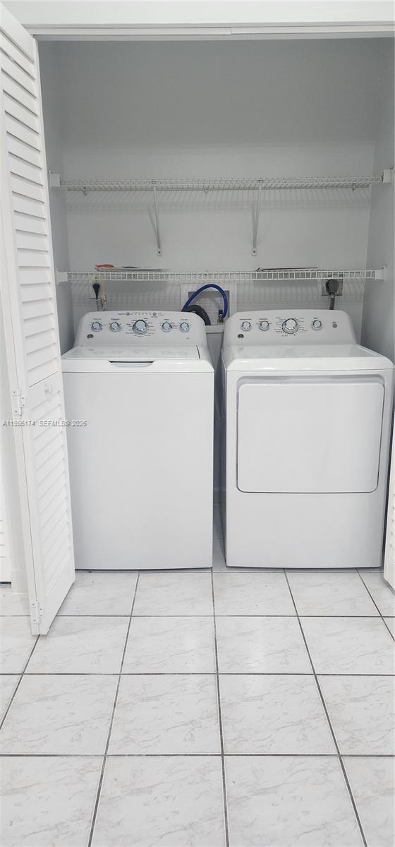 2574 West 71st Place Hialeah, FL 33016 - Photo 15 of 17 a utility room with dryer and washer