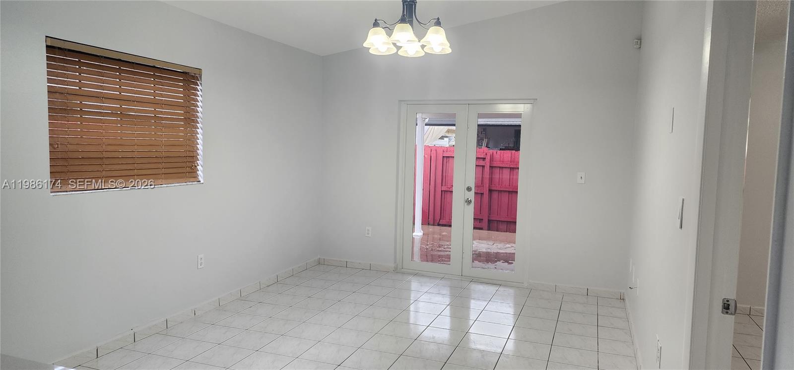 2574 West 71st Place Hialeah, FL 33016 - Photo 17 of 17 a view of an empty room with a window