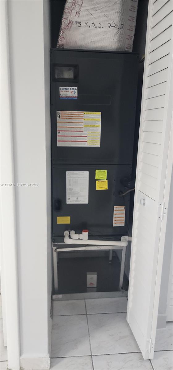 2574 West 71st Place Hialeah, FL 33016 - Photo 6 of 17 a kitchen with a sink and a microwave