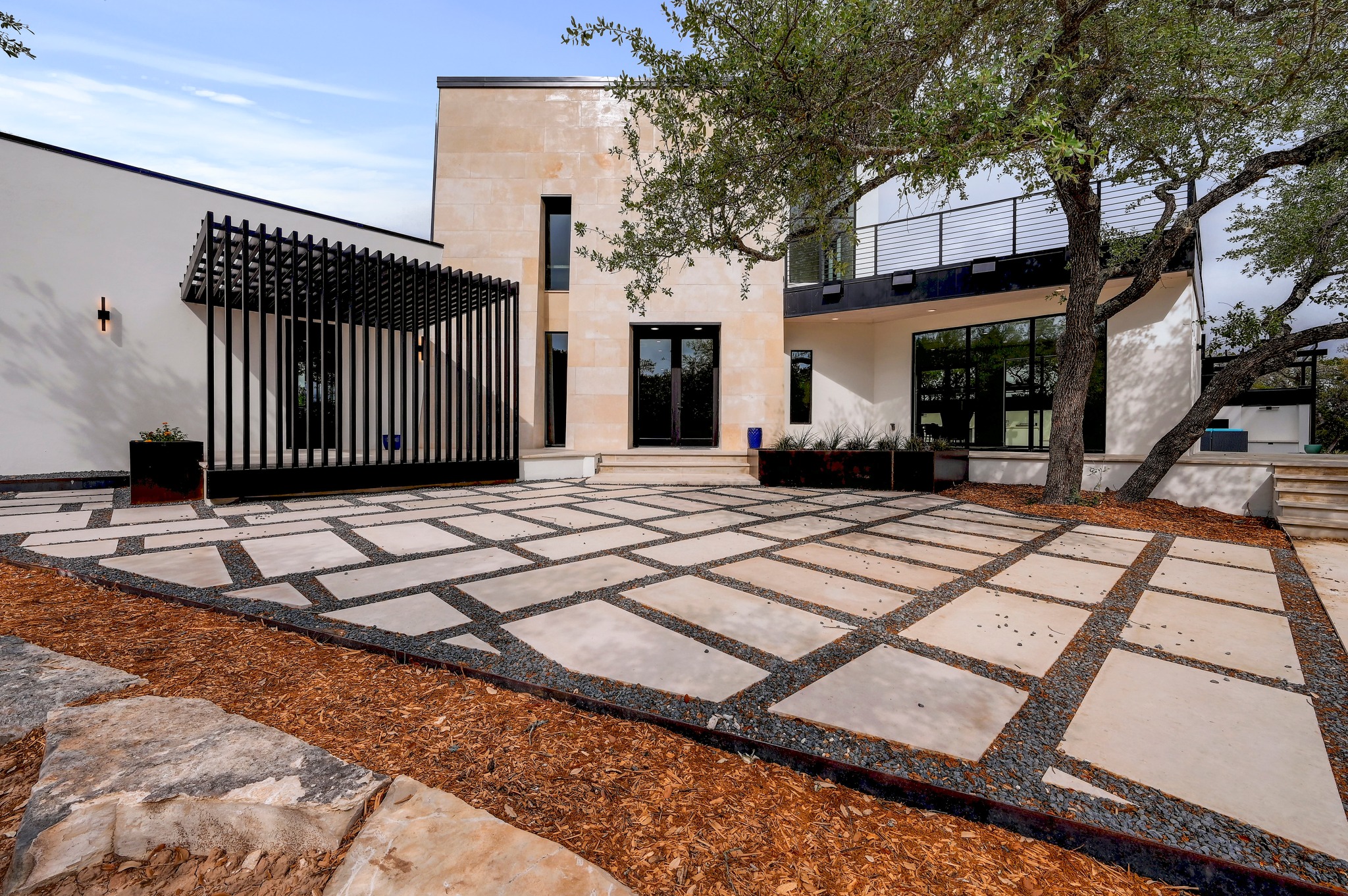 Side view of property with a patio, stucco siding, and a pergola