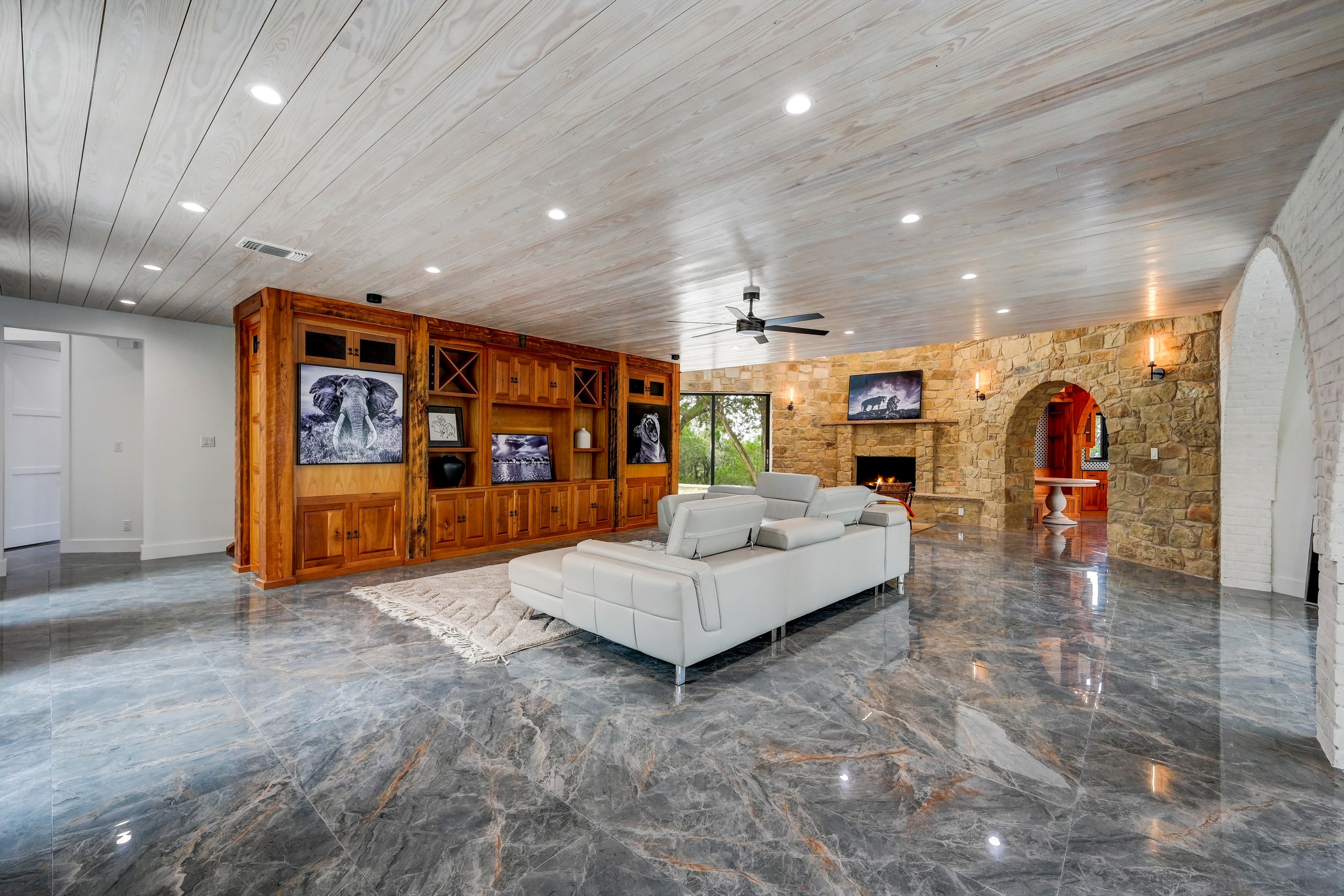 700 Rancho Grande Drive Wimberley, TX 78676 - Photo 5 of 39 Living area with a ceiling fan, recessed lighting, wooden ceiling, and a stone fireplace