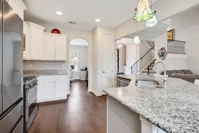 a kitchen with counter top space appliances and cabinets