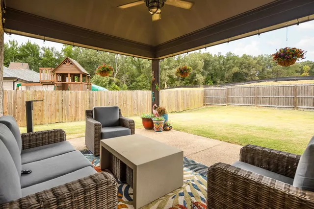 a outdoor living space with furniture and garden view
