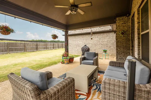 a view of a house with pool and chairs