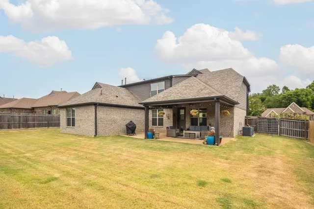 a swimming pool with some trees in the background