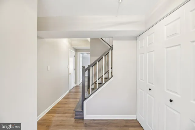 a view of an entryway with wooden floor