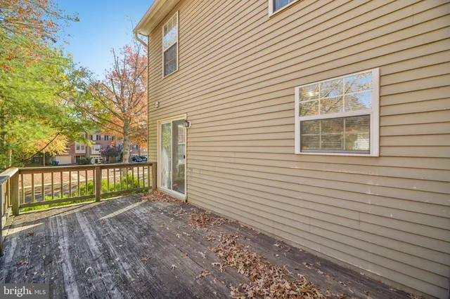 a view of a house with a small backyard