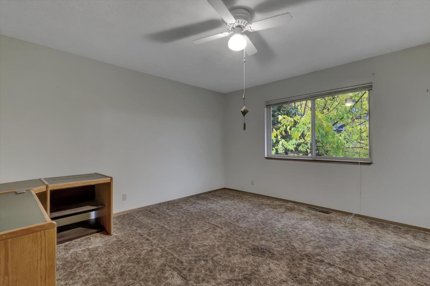 13032 Thistle Loop Penn Valley, CA 95946 - Photo 17 of 30 a view of an empty room with a window