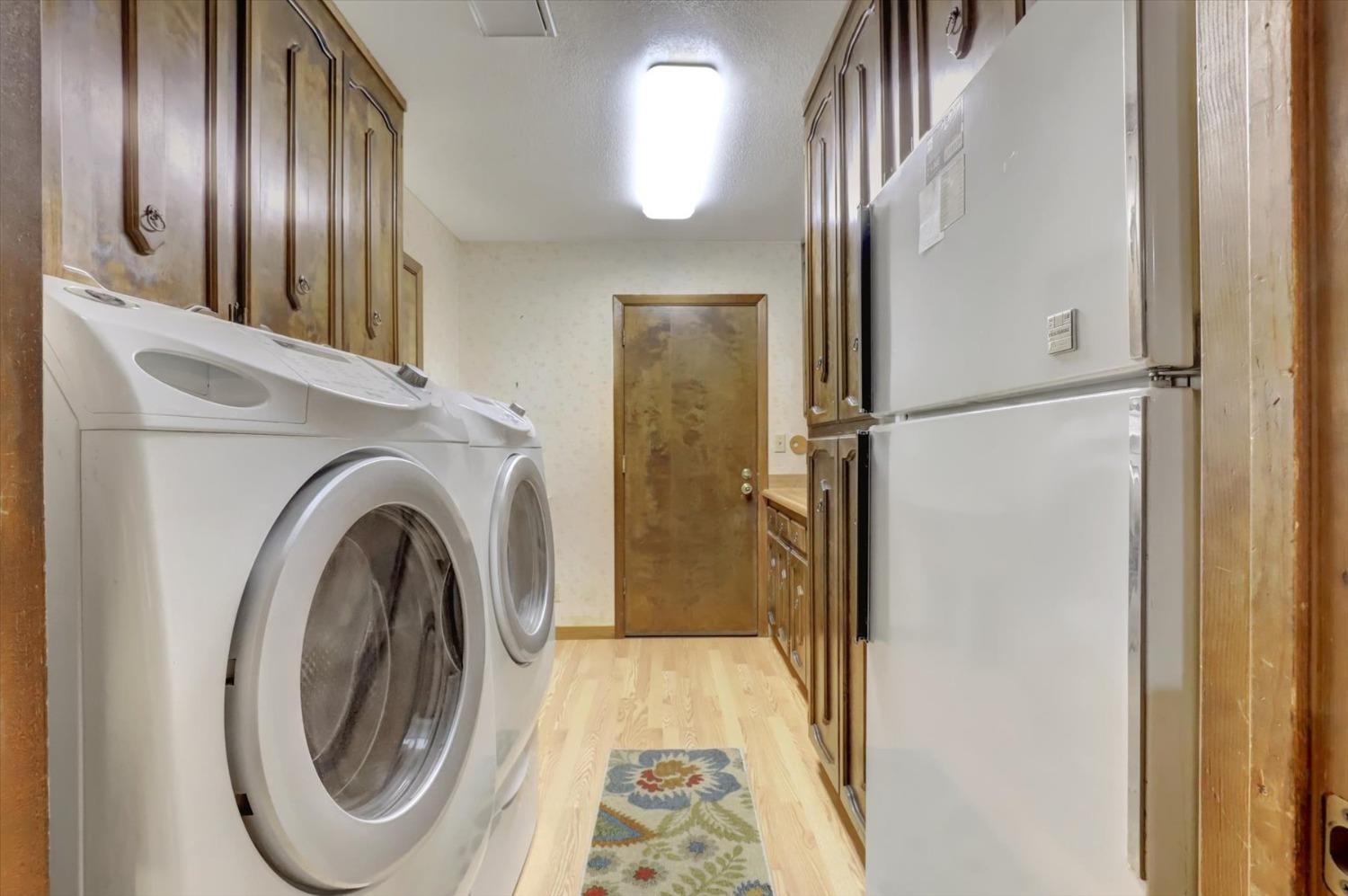 13032 Thistle Loop Penn Valley, CA 95946 - Photo 22 of 30 a view of a hallway with washer and dryer