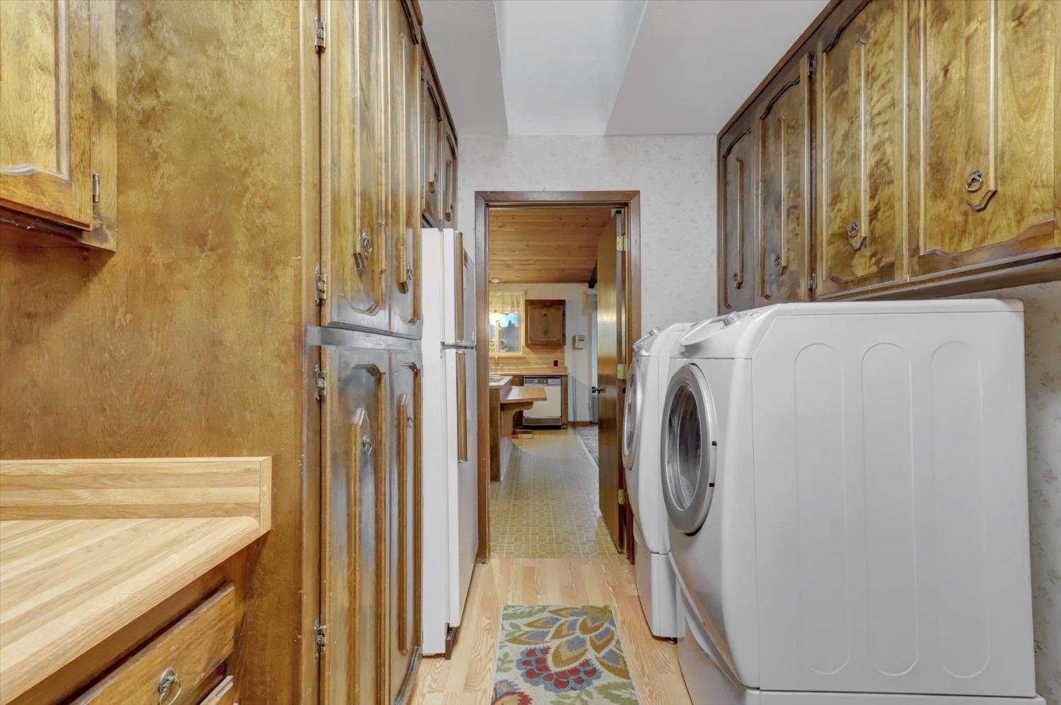 13032 Thistle Loop Penn Valley, CA 95946 - Photo 24 of 30 a utility room with dryer and washer