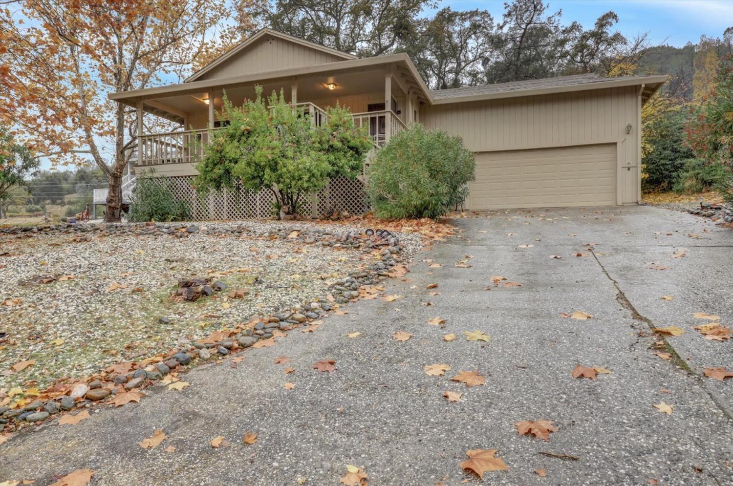 13032 Thistle Loop Penn Valley, CA 95946 - Photo 27 of 30 a front view of a house with a yard