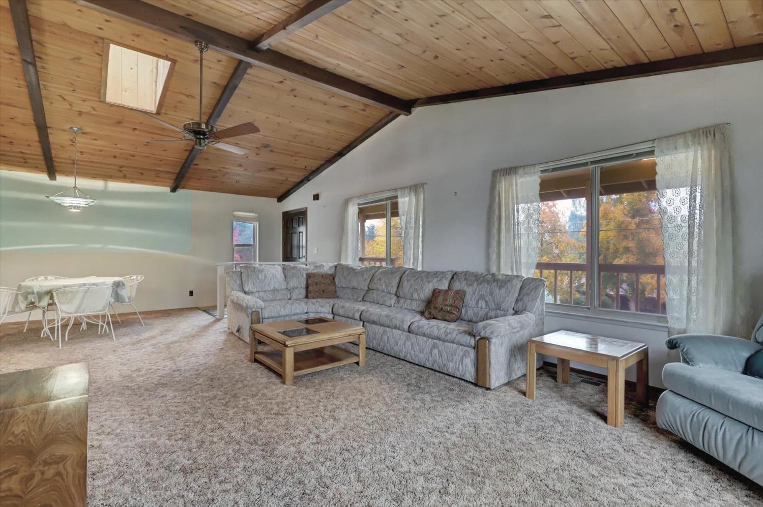 13032 Thistle Loop Penn Valley, CA 95946 - Photo 4 of 30 a living room with furniture and a ceiling fan