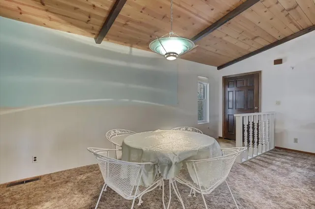 a view of a dining room with furniture