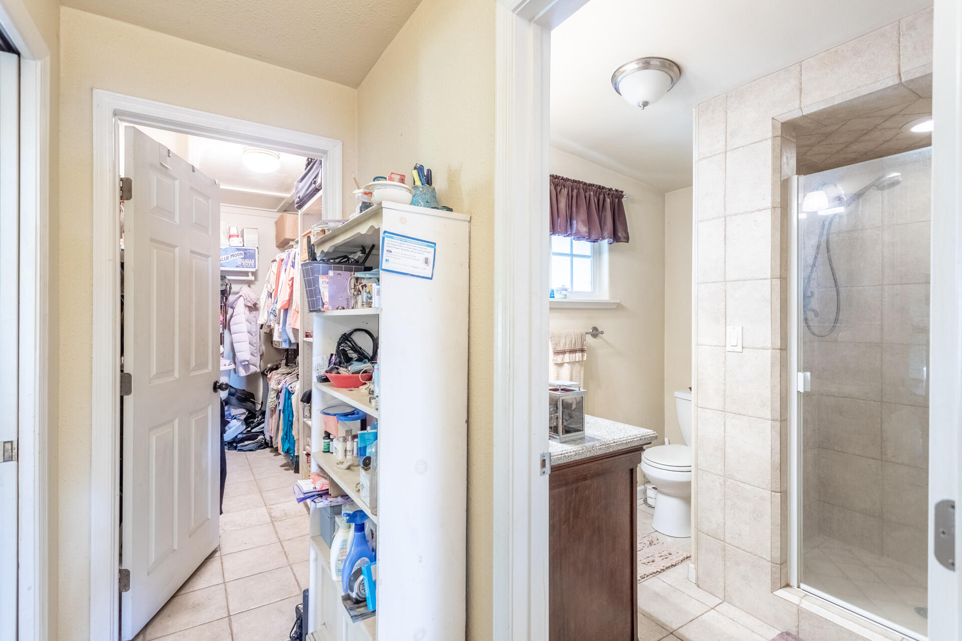 406 South Jackson Street Red Bluff, CA 96080 - Photo 12 of 26 a view of a hallway with shelves