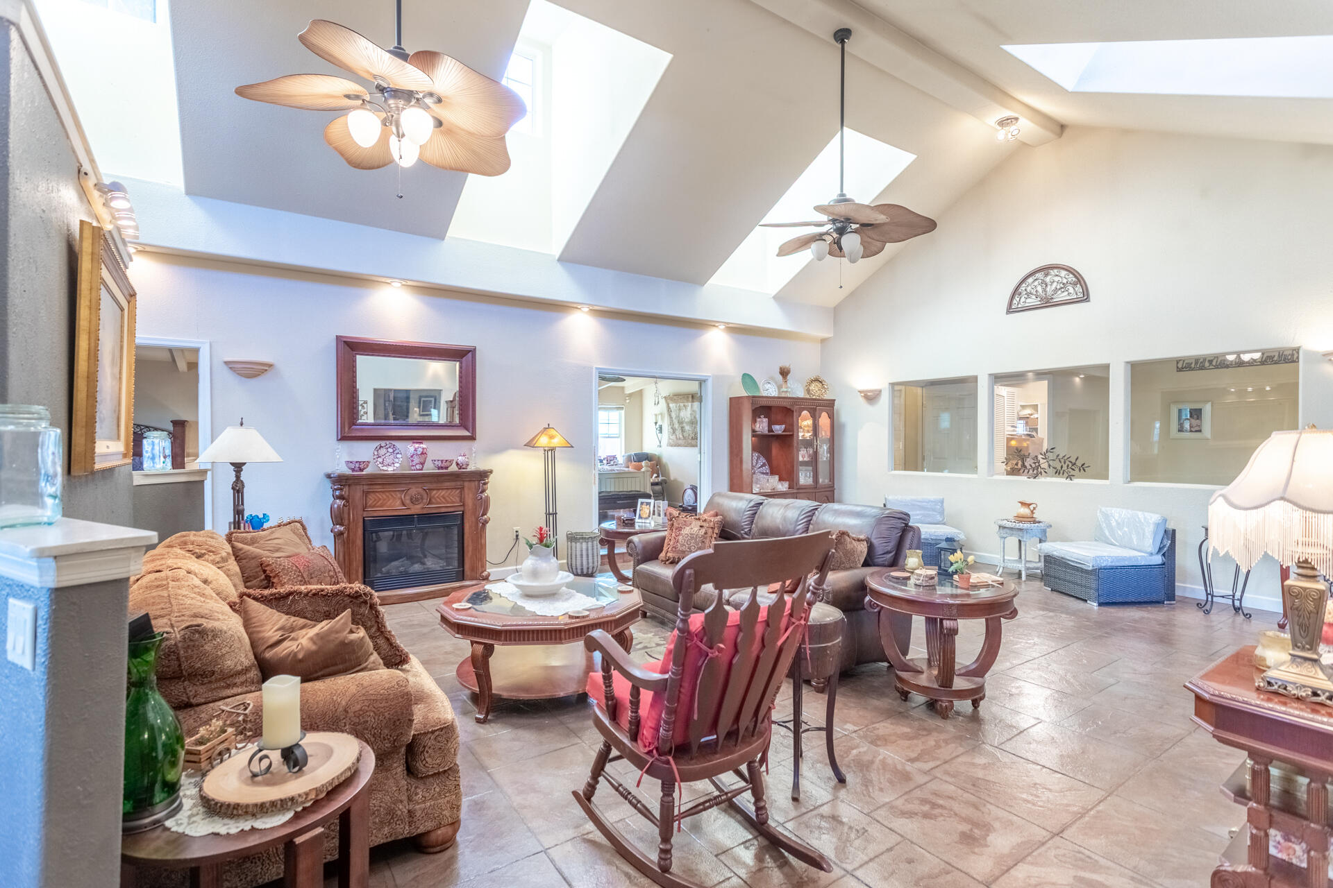 406 South Jackson Street Red Bluff, CA 96080 - Photo 5 of 26 a living room with furniture a fireplace and a chandelier
