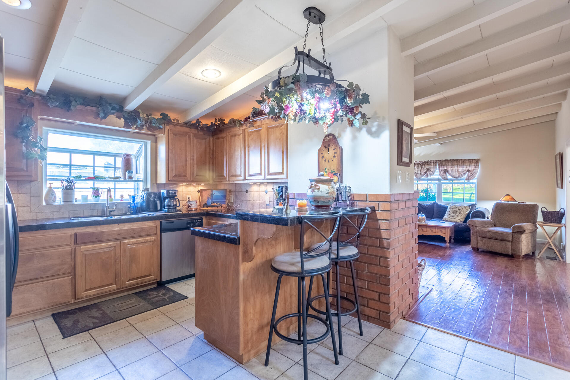 406 South Jackson Street Red Bluff, CA 96080 - Photo 10 of 26 a kitchen with granite countertop lots of counter top space and dining table