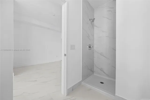 a large white kitchen with sink