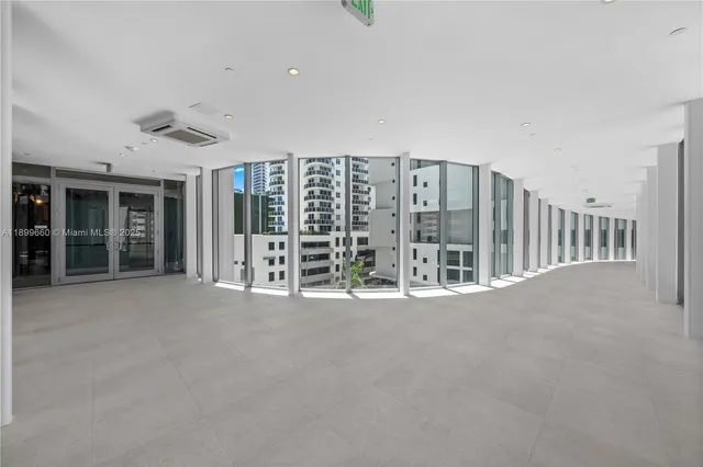 a view of an empty room with balcony