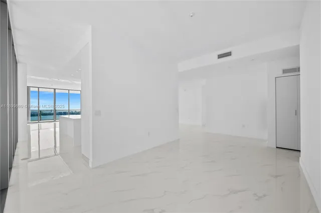 a view of a kitchen with counter and staircase