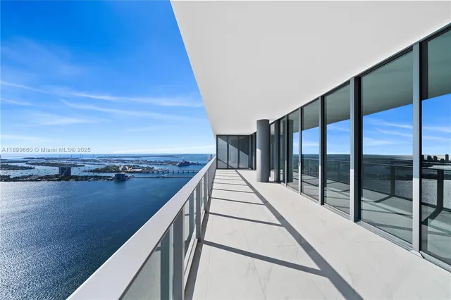 a view of empty room with floor to ceiling windows