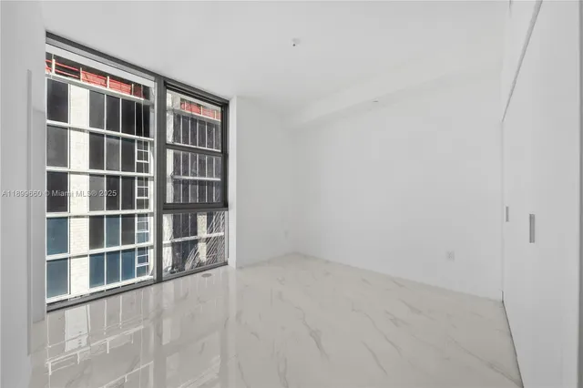 a view of a street with flower plants