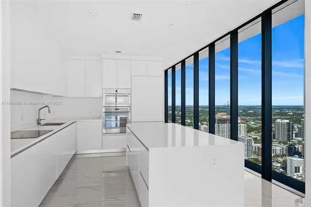 a balcony with chairs and a couch