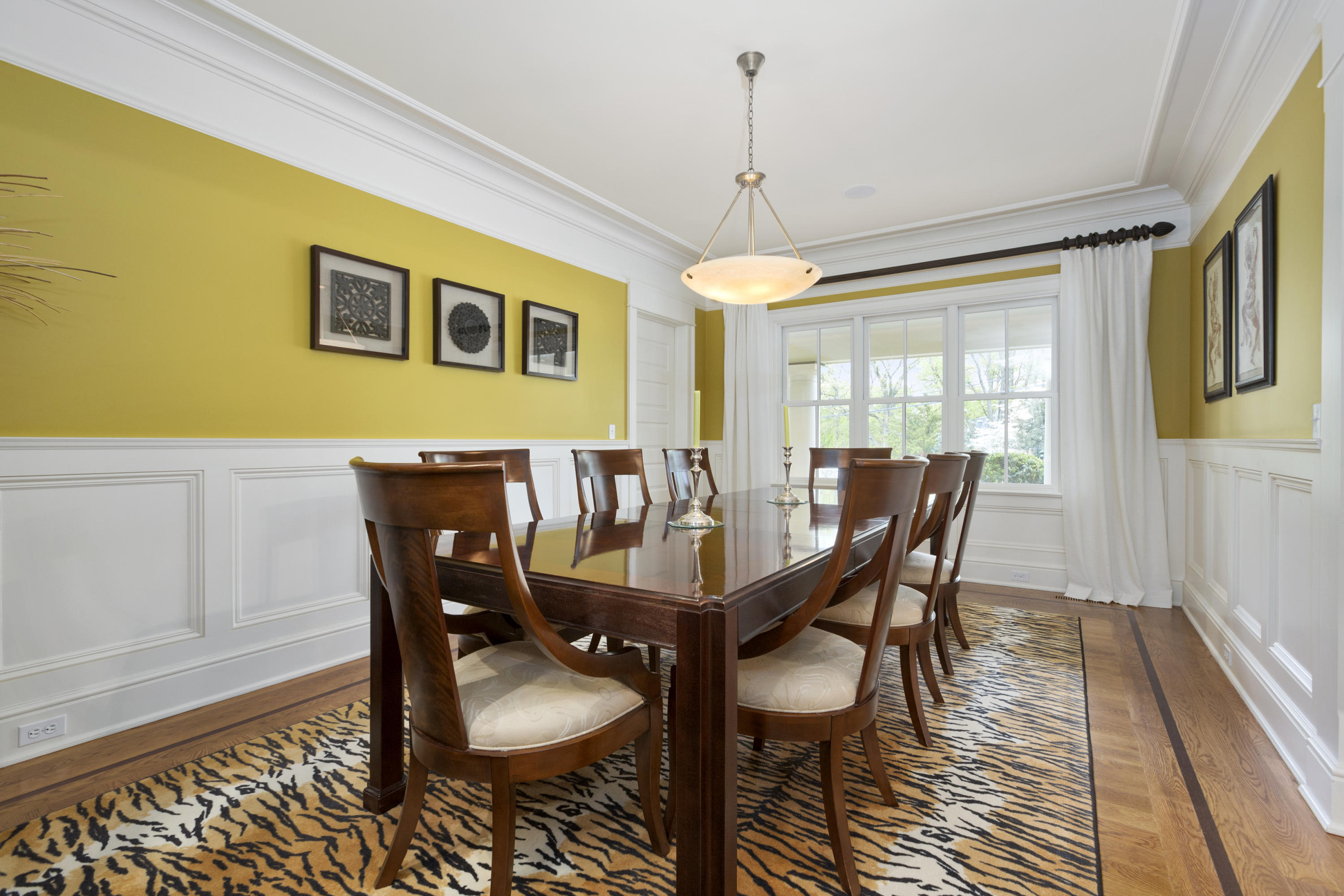 62 Stanton Road Darien, CT 06820 - Photo 15 of 52 a view of a dining room with furniture window and wooden floor