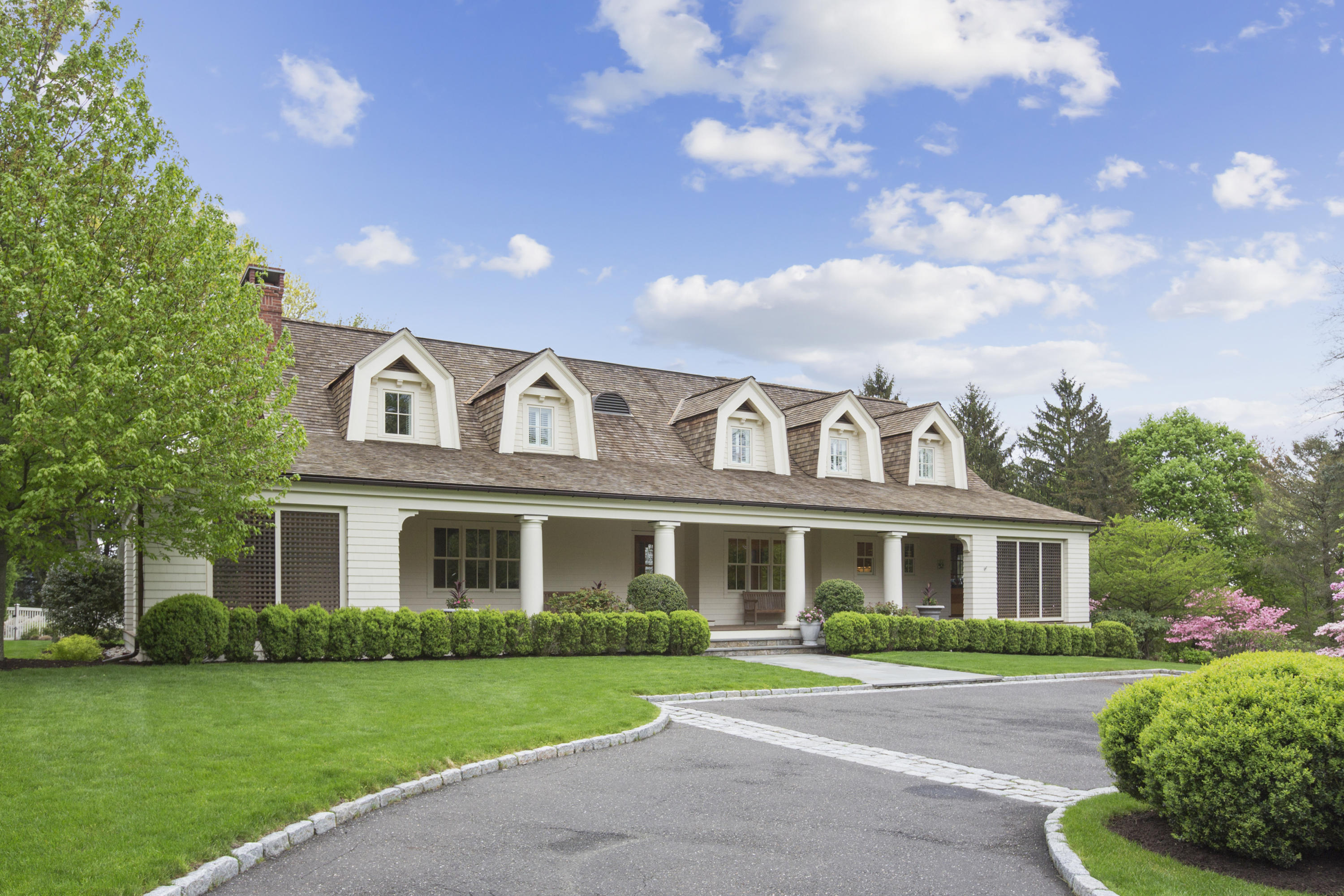 62 Stanton Road Darien, CT 06820 - Photo 2 of 52 a front view of a house with a yard and garage