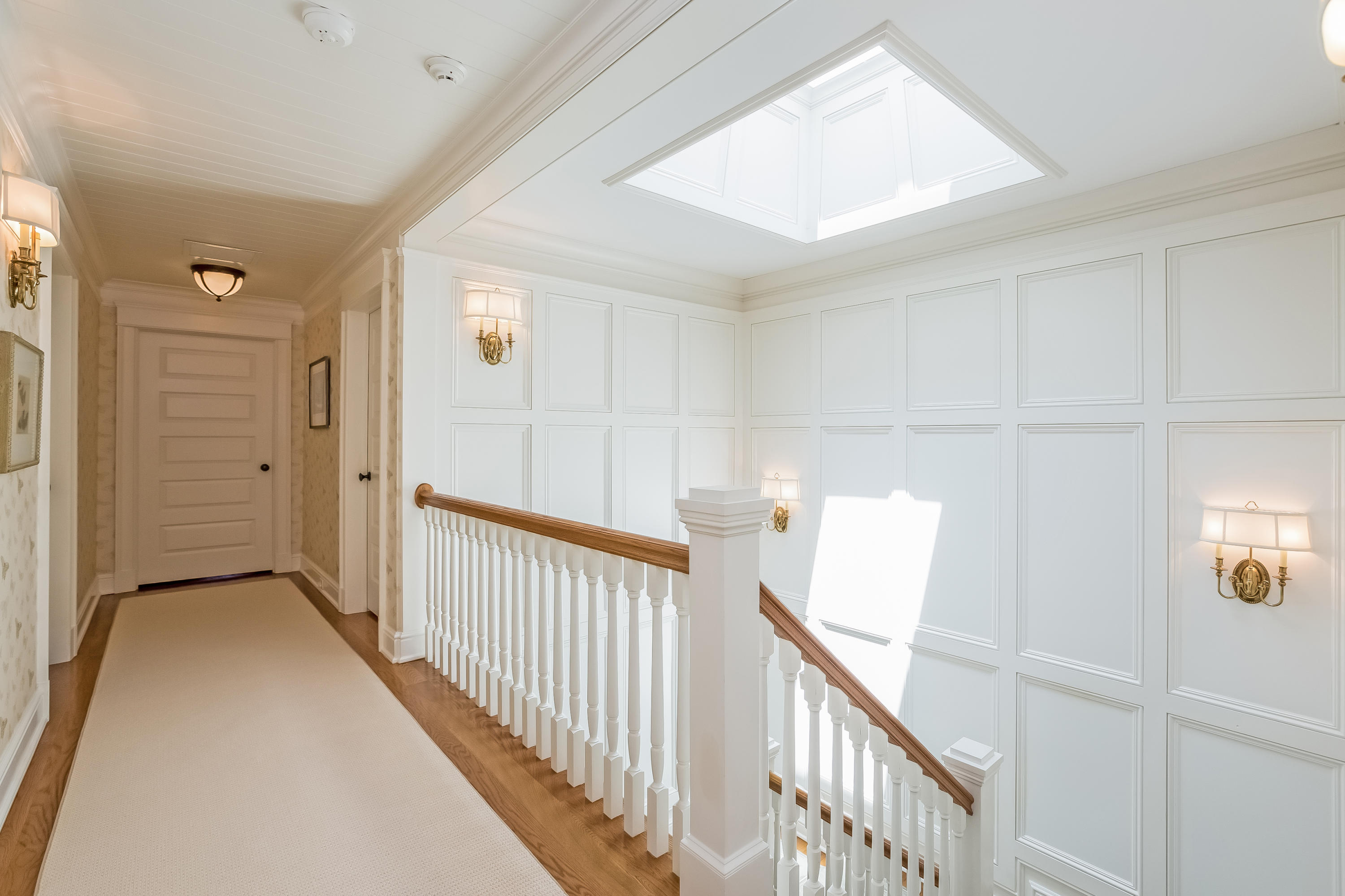 62 Stanton Road Darien, CT 06820 - Photo 23 of 52 a view of a hallway with wooden floor and windows