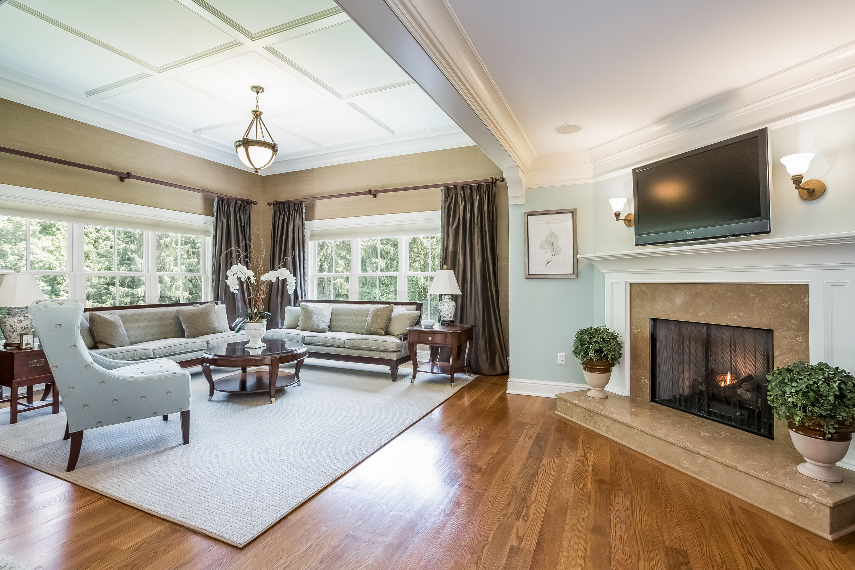 62 Stanton Road Darien, CT 06820 - Photo 25 of 52 a living room with furniture fireplace and a flat screen tv