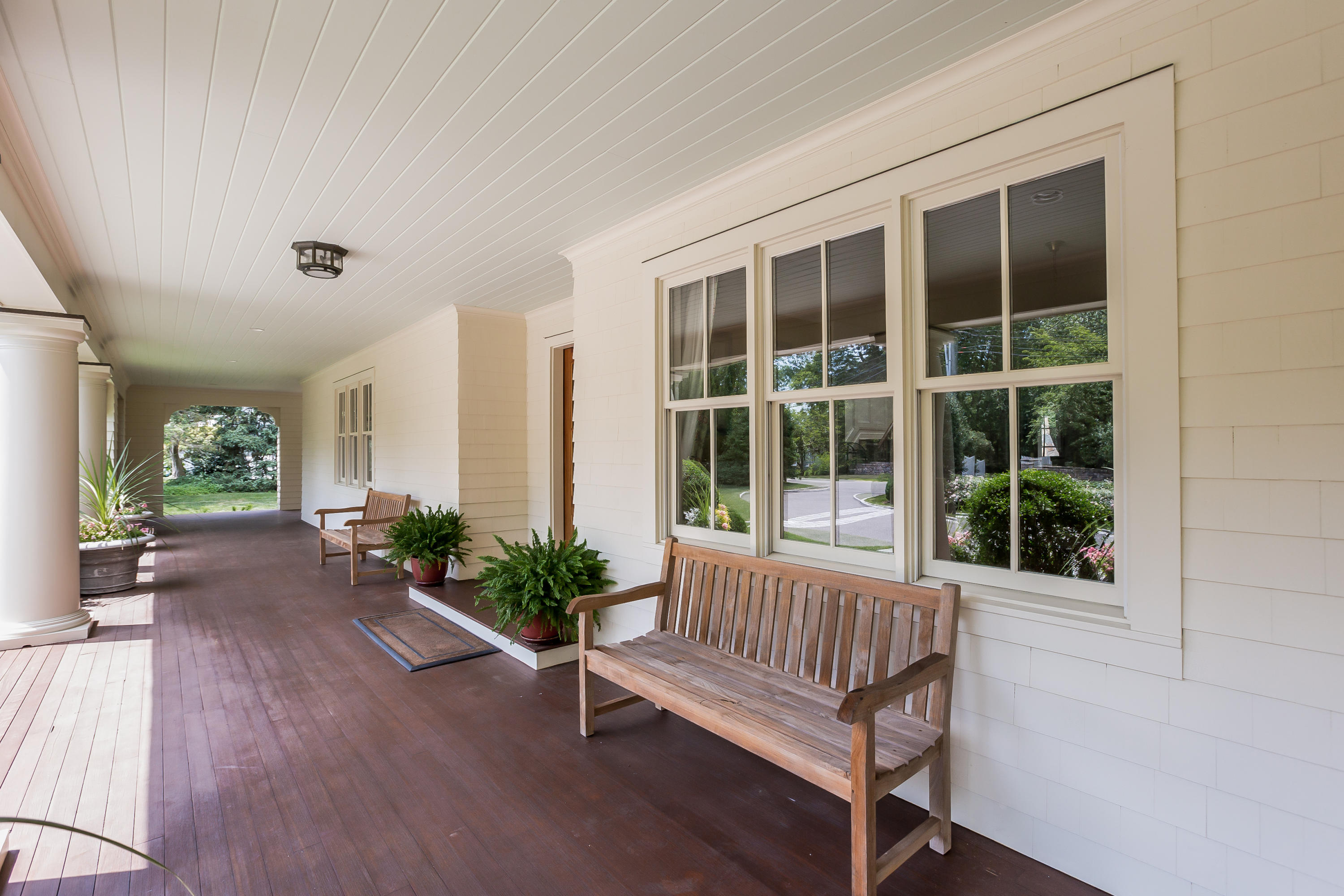 62 Stanton Road Darien, CT 06820 - Photo 37 of 52 a view of front door with potted plant and a porch