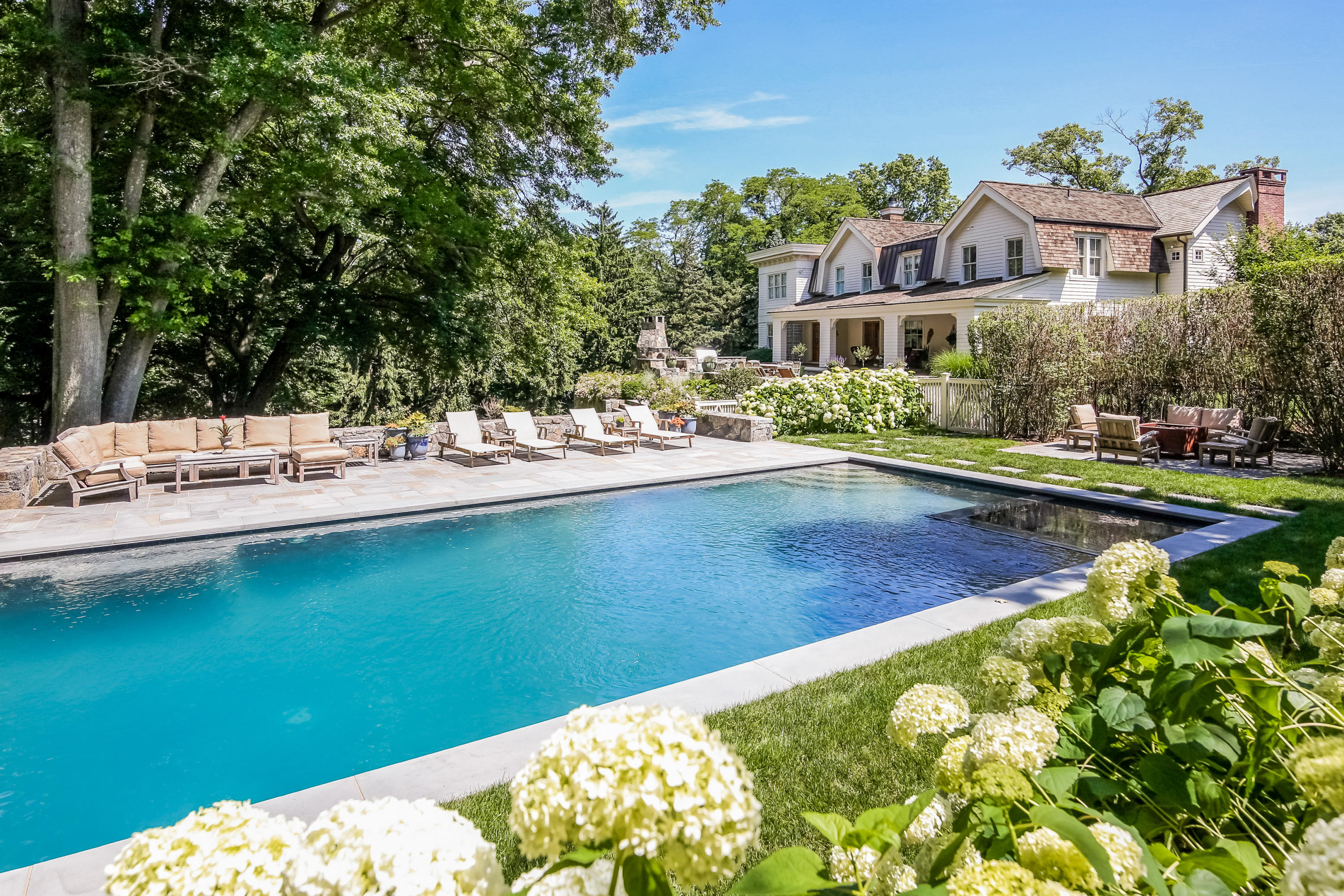 62 Stanton Road Darien, CT 06820 - Photo 41 of 52 a view of a house with pool and chairs