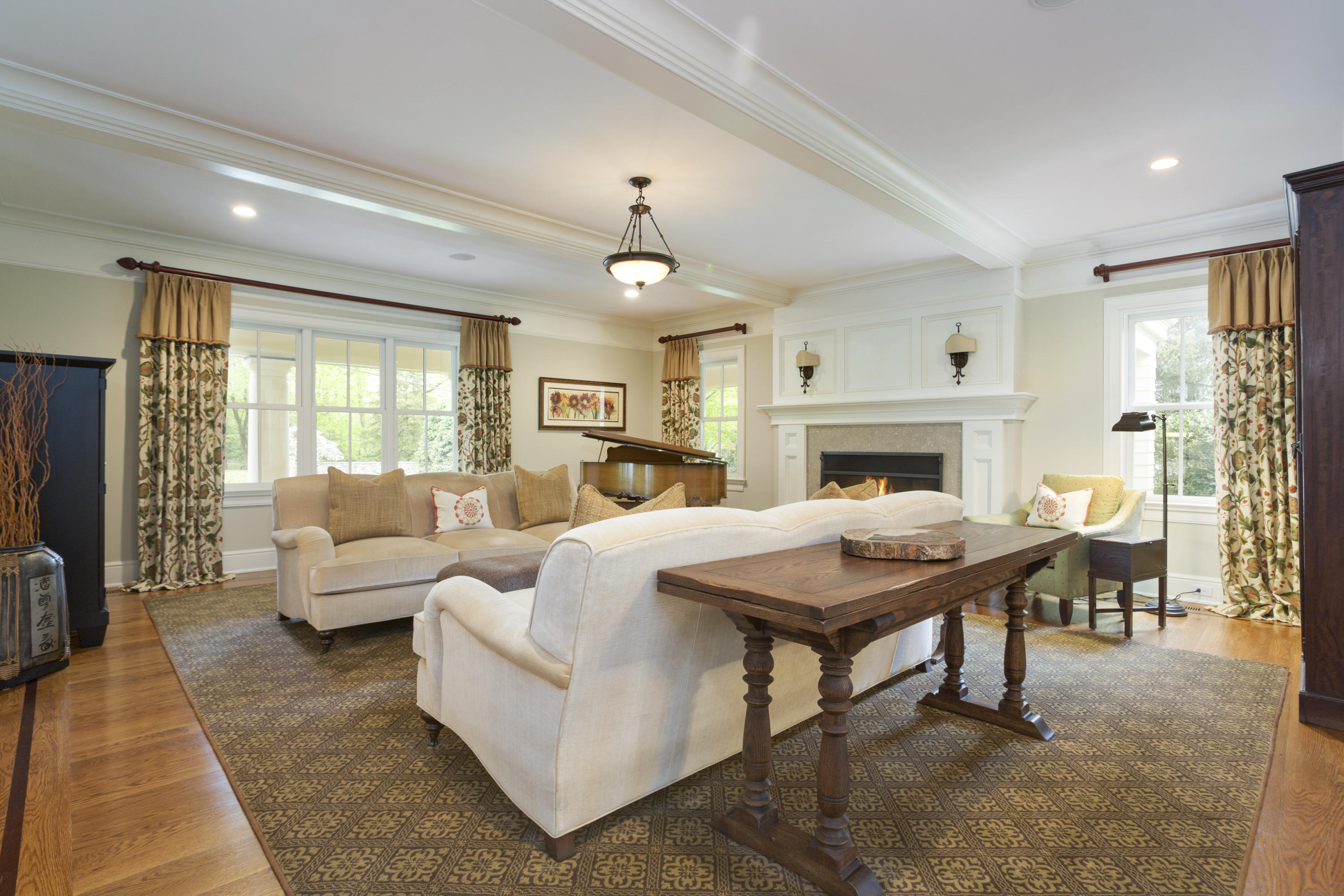 62 Stanton Road Darien, CT 06820 - Photo 6 of 52 a living room with furniture a fireplace and a table