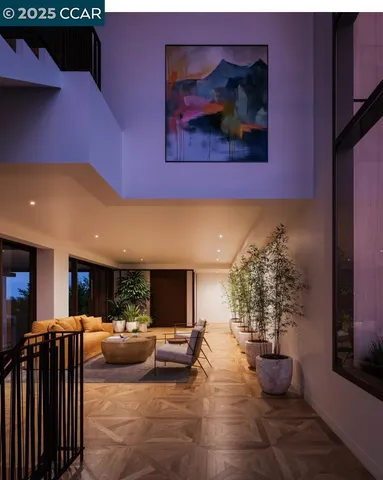 a living room with furniture and a potted plant