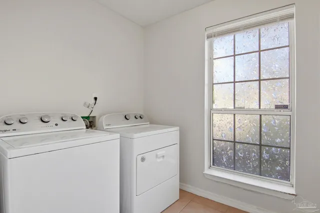 a view of storage and utility room with washer and dryer