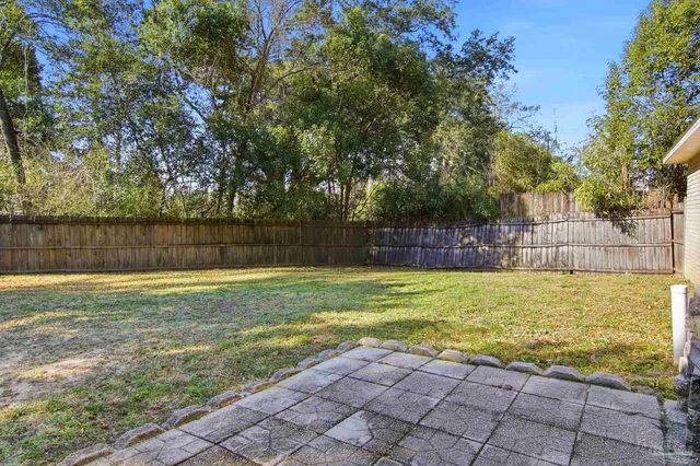 a view of a swimming pool with a backyard