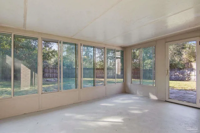 a view of an empty room with windows