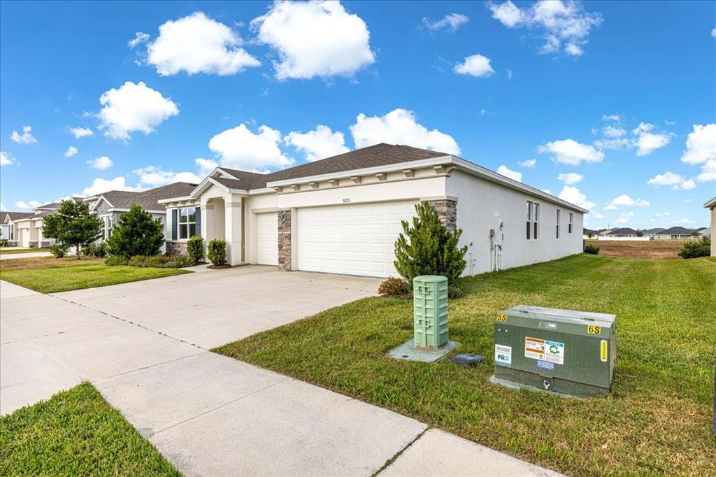 5851 Southwest 85th Place Ocala, FL 34476 - Photo 47 of 57 a view of a house with a yard
