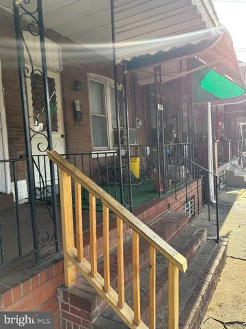 a balcony with table and chairs