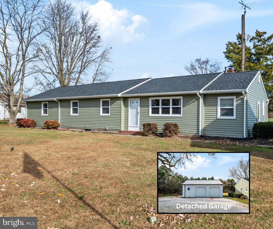 4305 Langrell Road Preston, MD 21655 - Photo 1 of 36 a view of a yard in front of a house with large tree