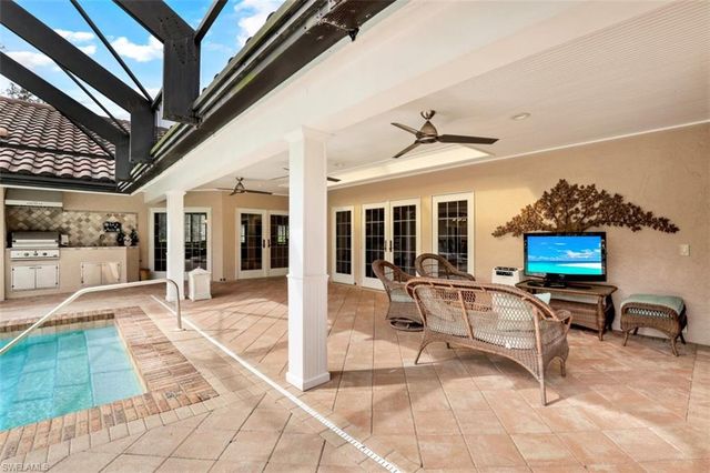 a view of a hall with sitting area