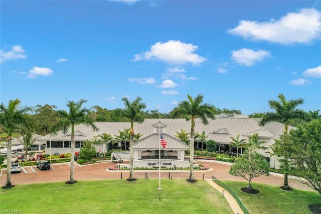a view of swimming pool with outdoor seating
