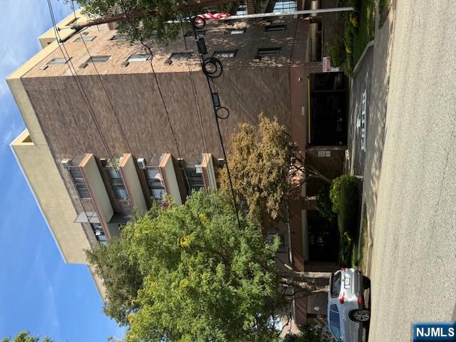 140 Euclid Avenue, Unit 4G Hackensack, NJ 07601 - Photo 1 of 13 a car parked in front of a building