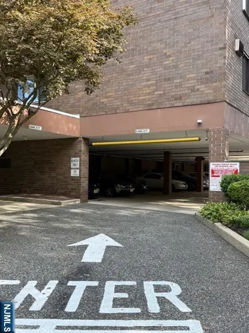 a front view of a building with a yard