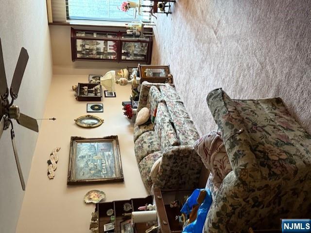 140 Euclid Avenue, Unit 4G Hackensack, NJ 07601 - Photo 6 of 13 a living room with furniture and a flat screen tv